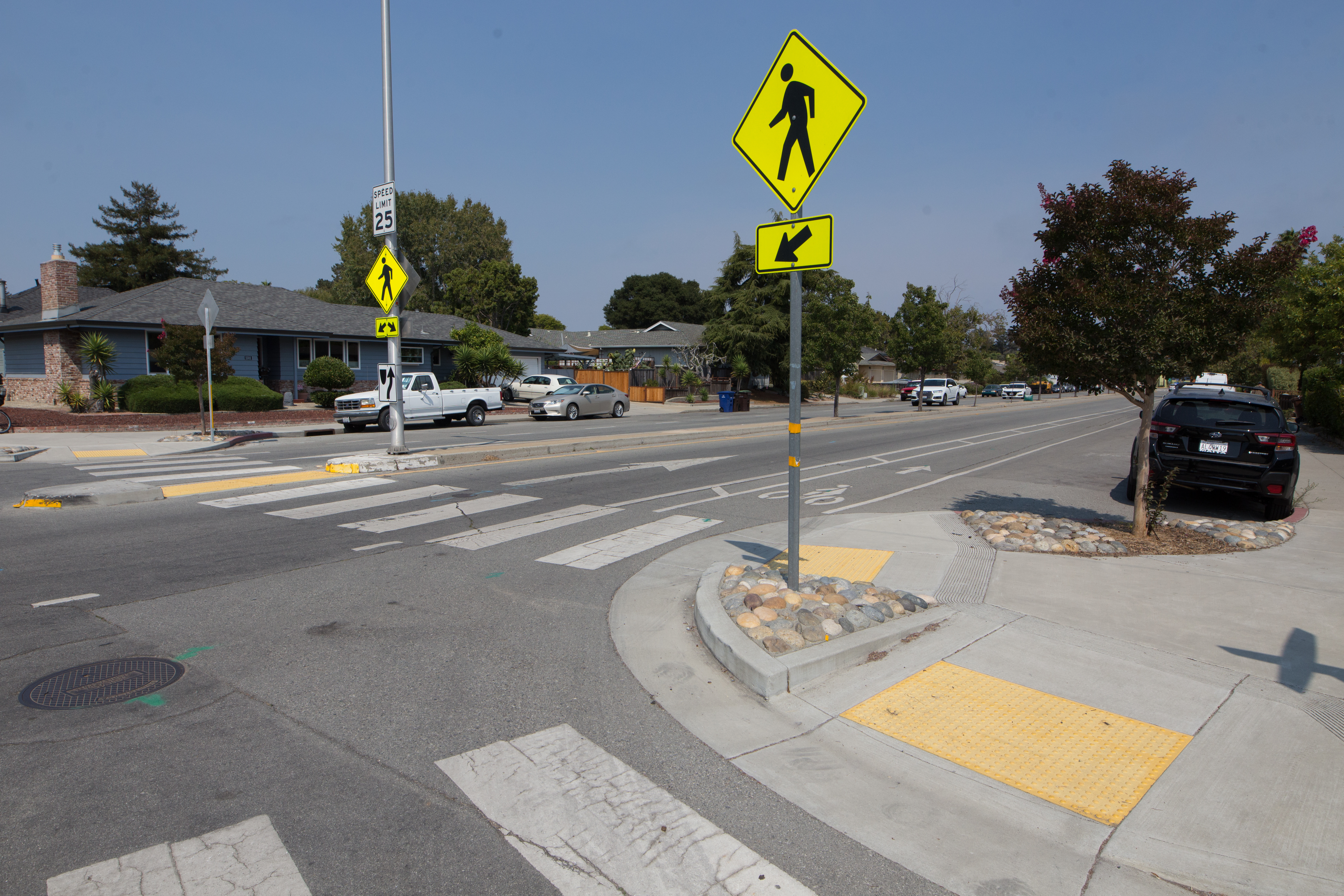 This image is an example of a high visibility crosswalk with curb ramps.