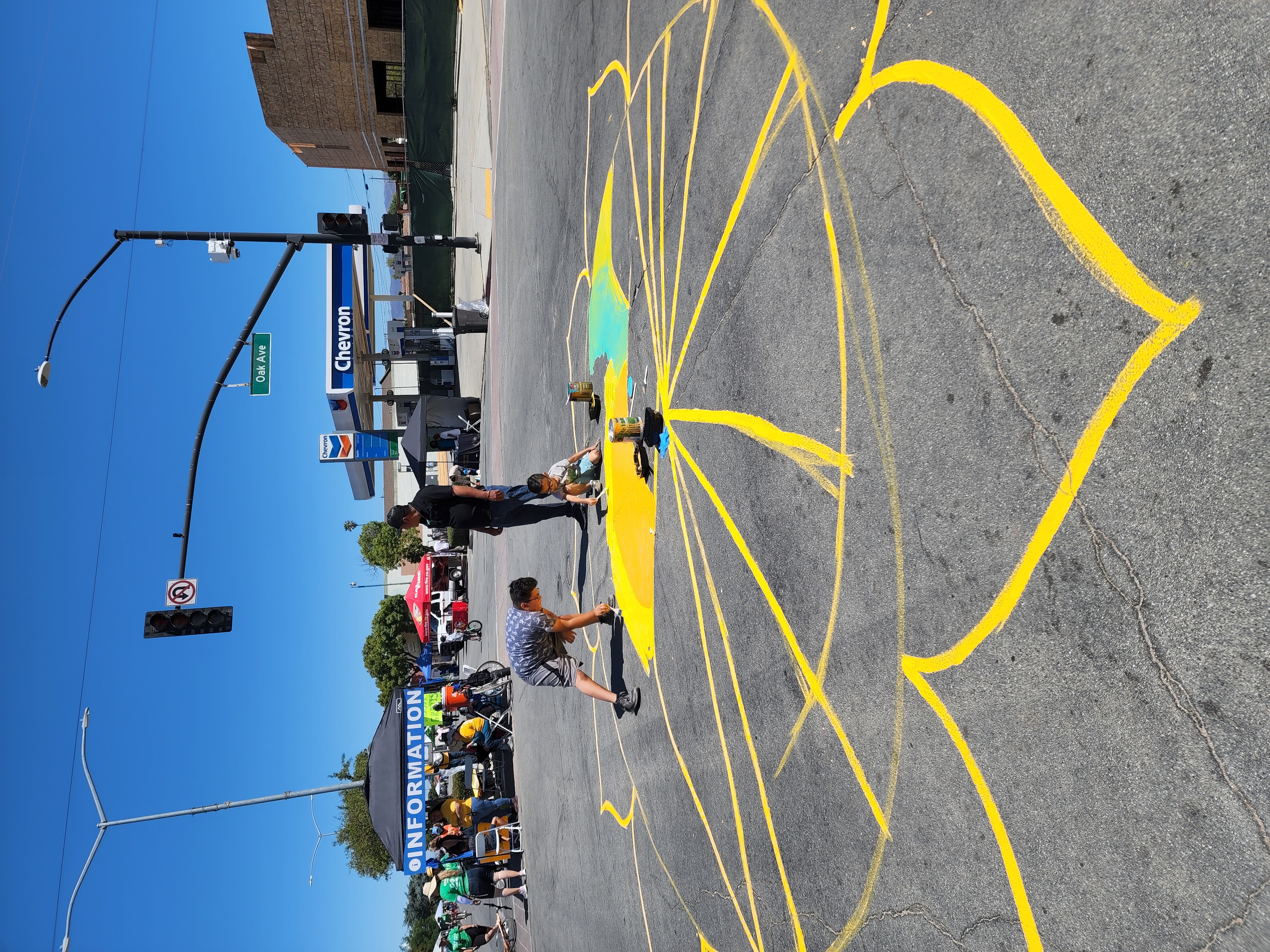 This image is sidewalk art painted during a Ciclovía event.