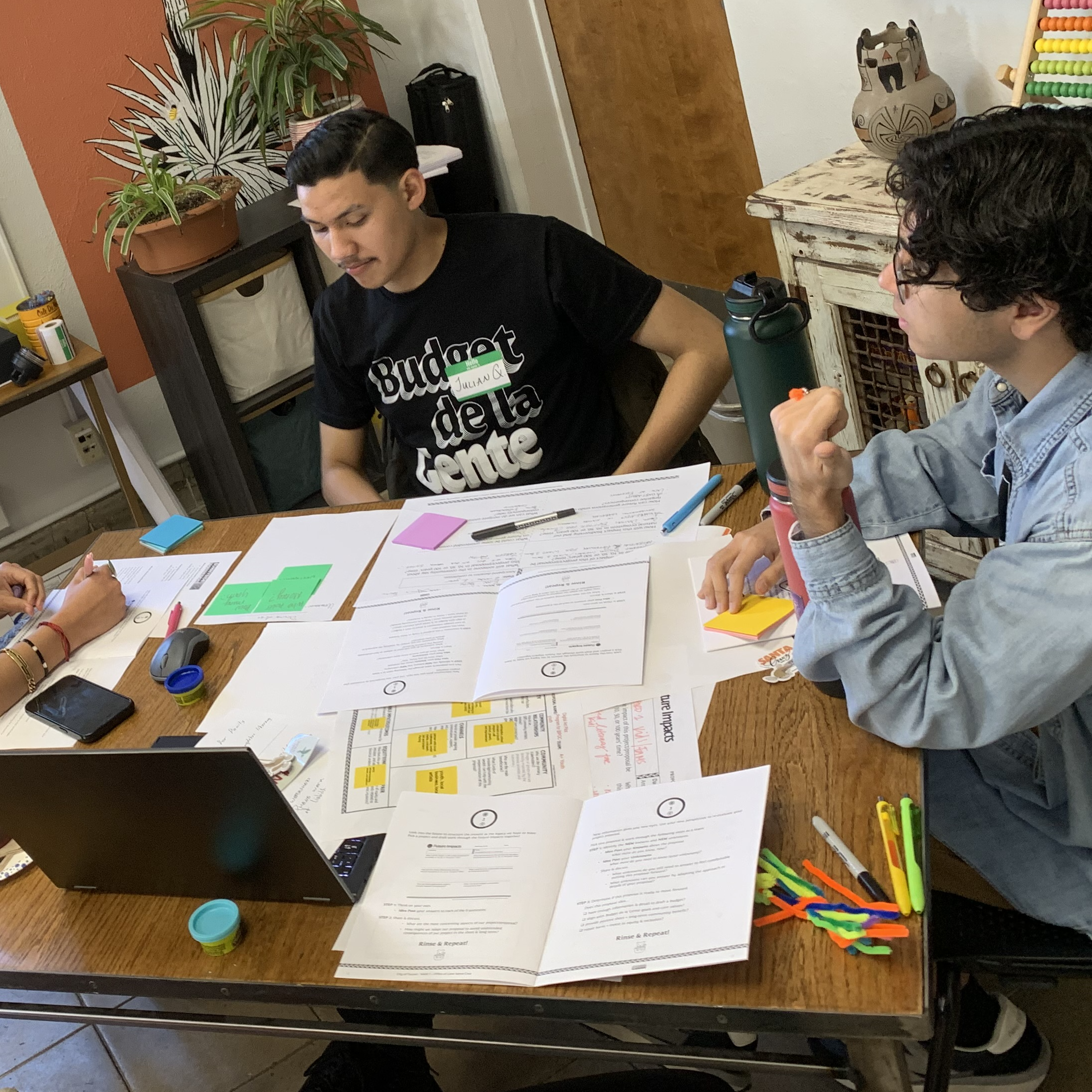 Youth at a table working on a collaborative project