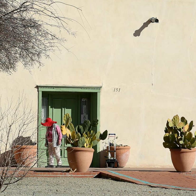 Entrance to the Sosa-Carrillo house. Large pots with cactus are on either side of the entrance.